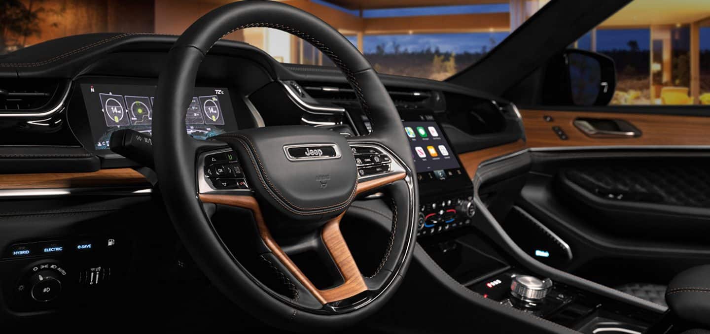 Display A close-up of the steering wheel in the 2023 Jeep Grand Cherokee Summit Reserve.