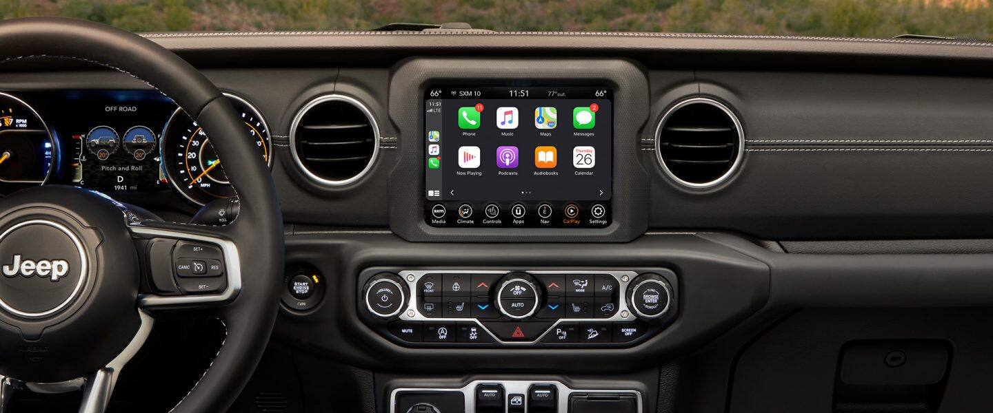 A close-up of the Uconnect touchscreen in the 2021 Jeep Wrangler Sahara.