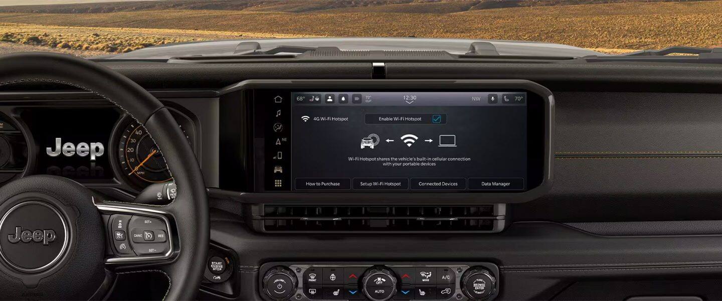 A close-up of the Uconnect touchscreen in the 2021 Jeep Wrangler Sahara.