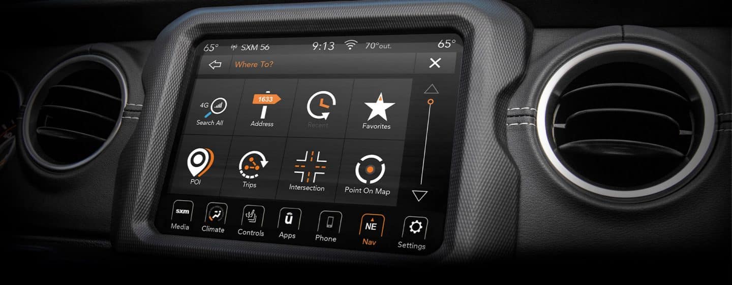 A close-up of the Uconnect 8.4-inch touchscreen in the 2023 Jeep Gladiator displaying a variety of menu selections.