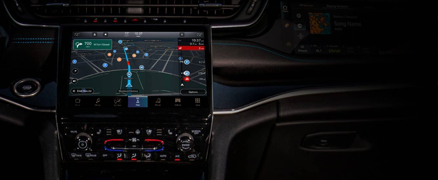 The Uconnect touchscreen in the 2023 Jeep Grand Cherokee Summit Reserve on the Apps screen.