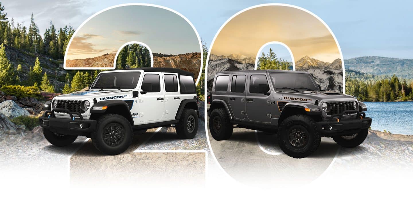 A white 2023 Jeep Wrangler Rubicon 4xe 20th Anniversary Edition and a gray 2023 Jeep Wrangler Rubicon 392 20th Anniversary Edition are parked beside a lake with mountains in the background. A large semi-transparent numeral 20 is positioned directly behind the vehicles.
