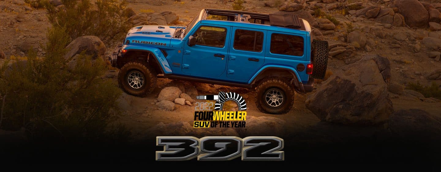 2022 Four Wheeler SUV of the Year. The 2023 Jeep Wrangler Rubicon 392 parked off-road in a rock-studded desert.