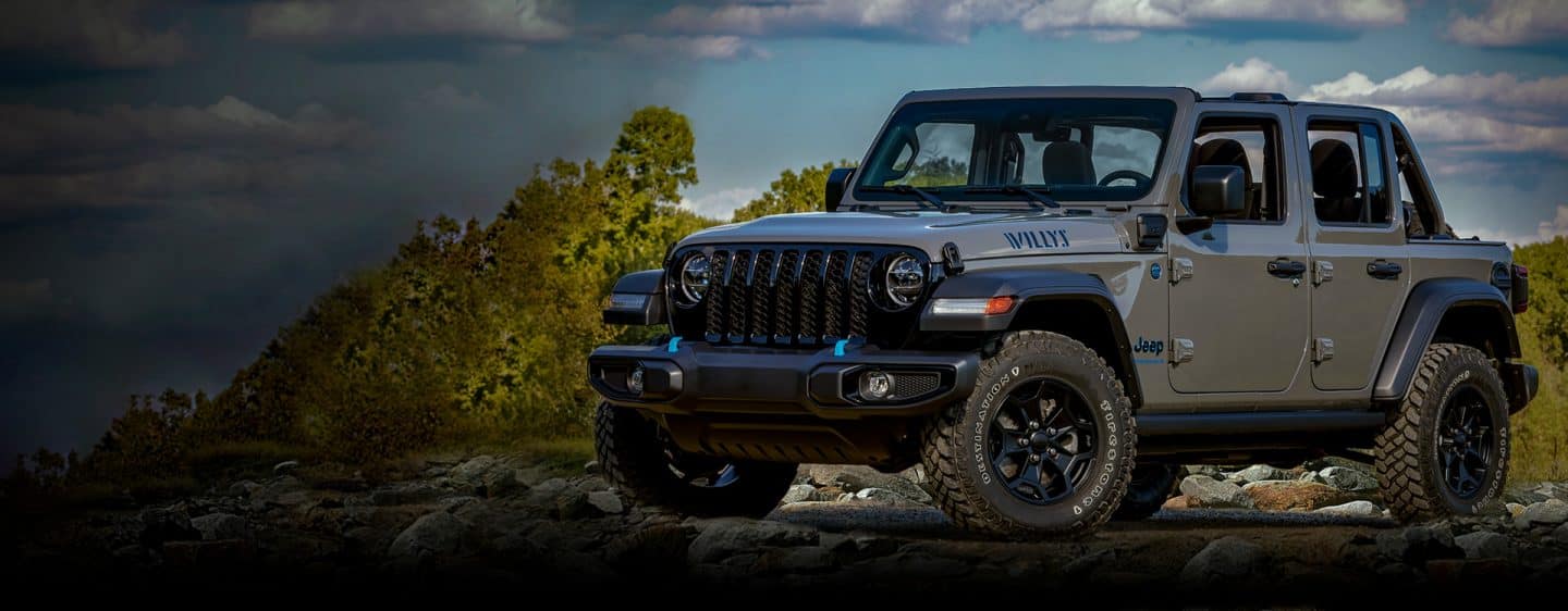 2023 Wrangler Sahara gas model shown (left), Starting at MSRP* $46,120. 2023 Wrangler Willys 4xe model shown (right), Starting at MSRP* $54,735. The Memorial Day Sales Event logo.