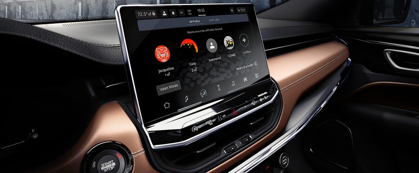 The Uconnect touchscreen in the 2025 Jeep Compass Limited displaying the passengers' smartphones that are currently connected to the system.