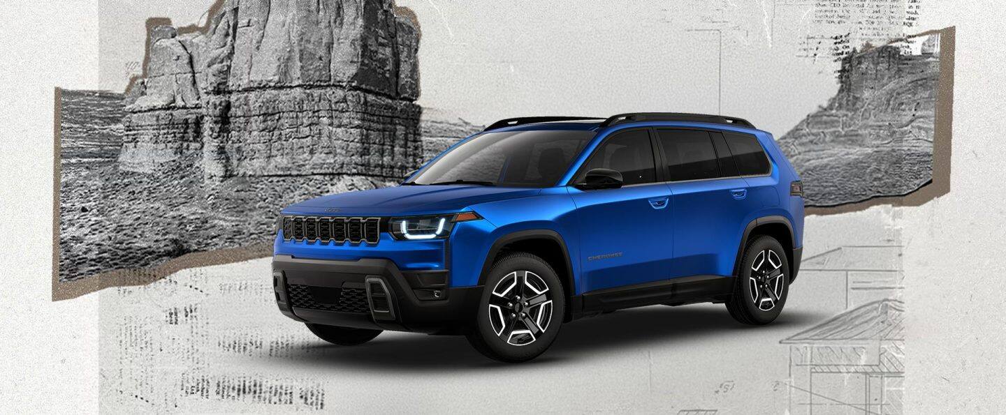 Ángulo delantero del lado del conductor de un Jeep Cherokee Laredo 2026 azul.