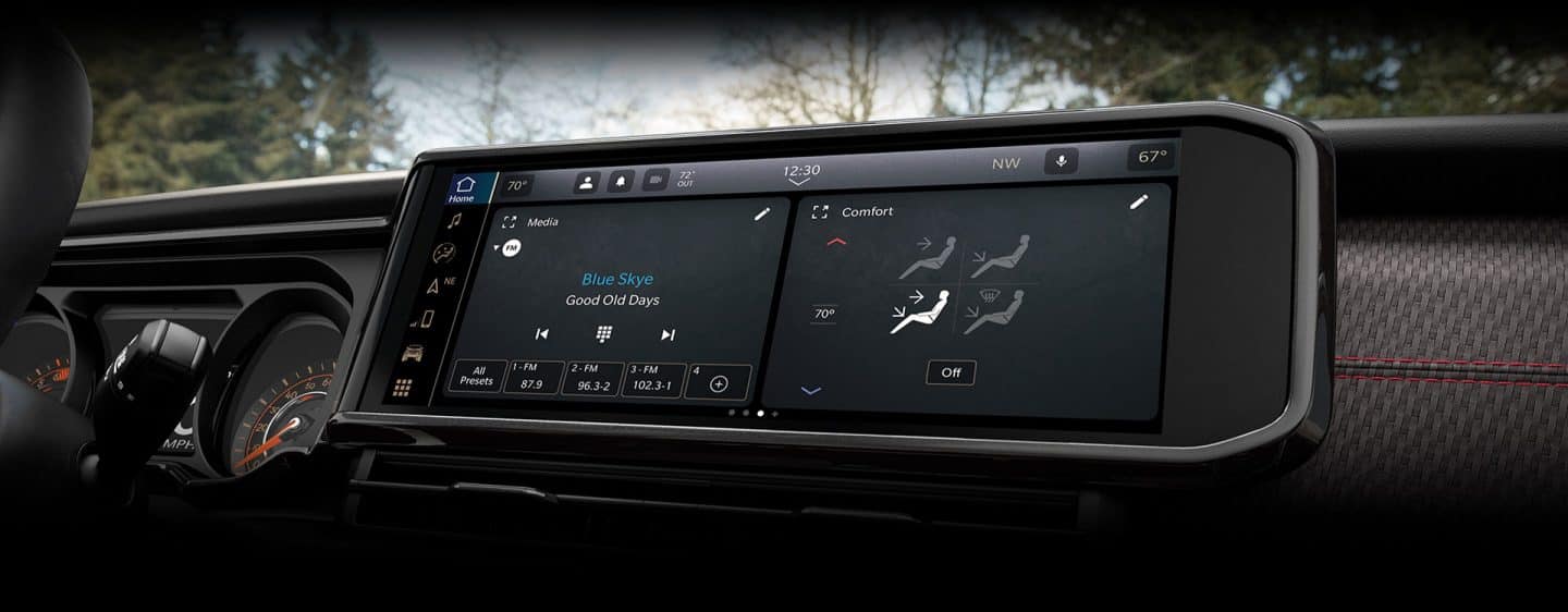 A close-up of the Uconnect touchscreen in the 2024 Jeep Gladiator displaying a variety of menu selections.