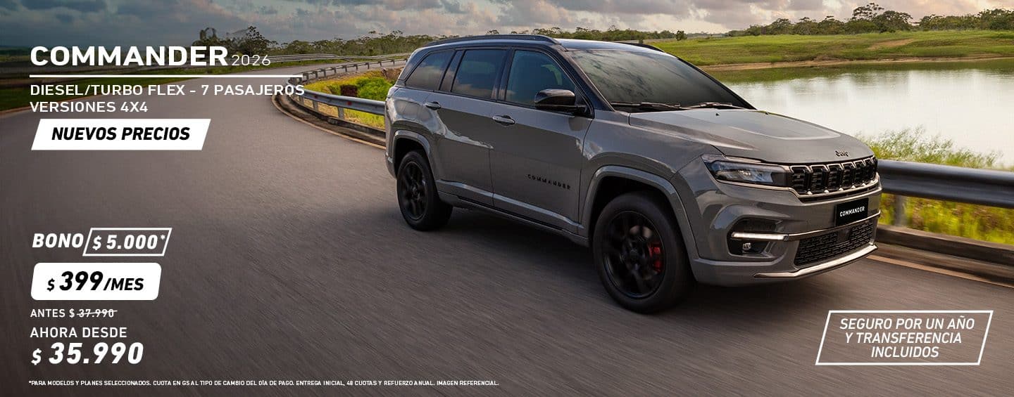 Jeep Commander color gris recorriendo un camino fuera de ruta, en un terreno desértico.