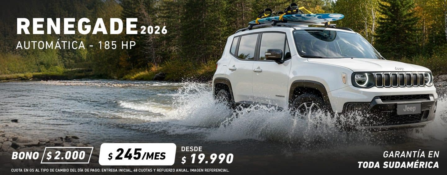 A blue gray 2023 Jeep Renegade Trailhawk fording through a narrow creek off-road, with water spraying above the vehicle's wheel wells. Renegade.