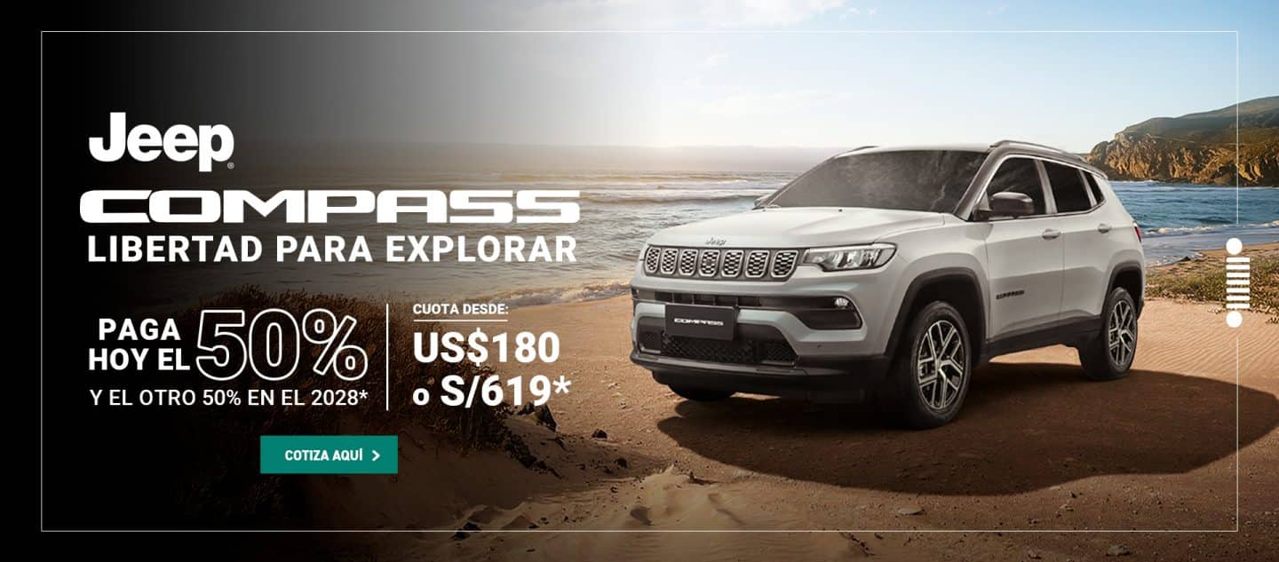 Jeep Compass blanco en la playa