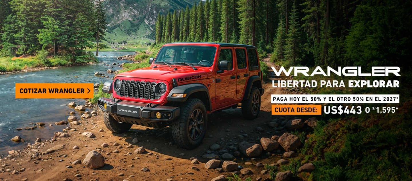 Jeep Wrangler todoterreno color rojo al lado de un río