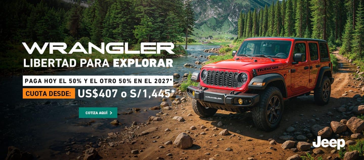 Jeep Wrangler todoterreno color rojo al lado de un río