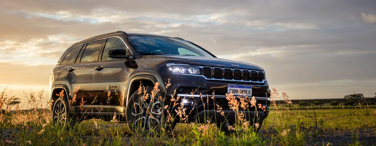 A 2023 Jeep Cherokee Altitude Lux being driven on a highway.