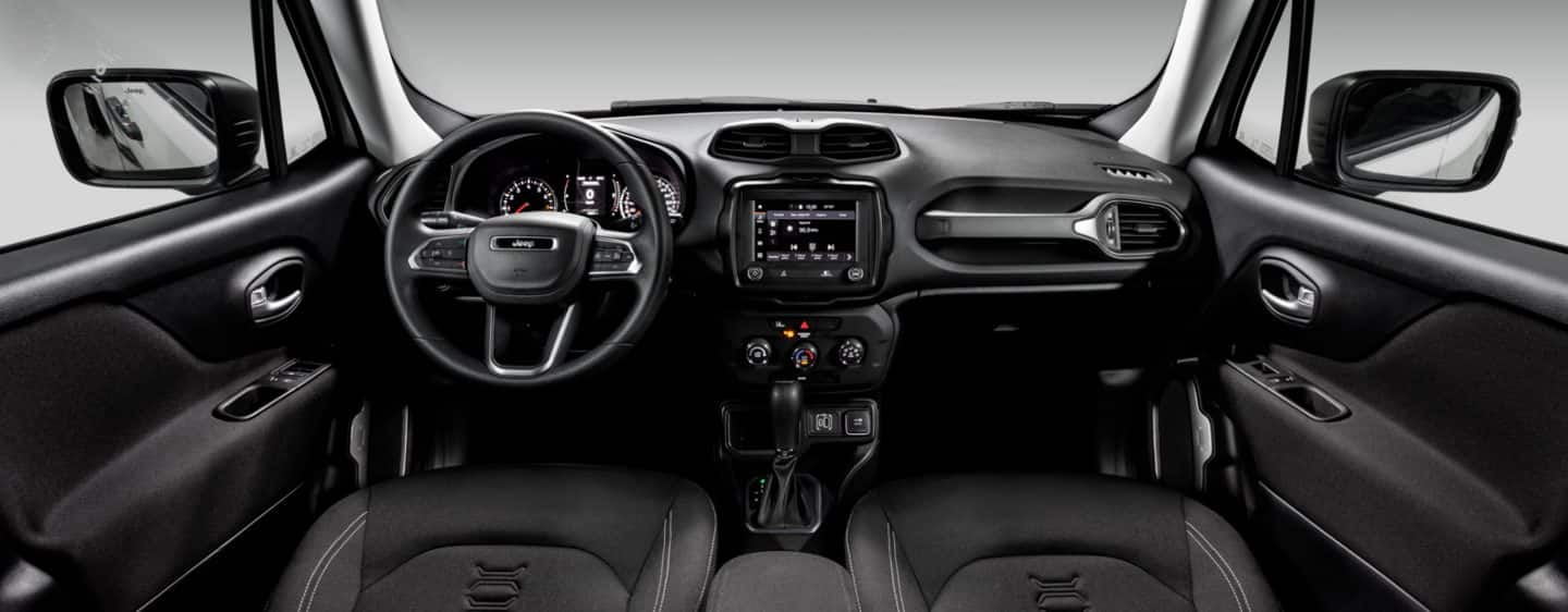 The steering wheel. touchscreen, center console and dashboard in the 2023 Jeep Renegade.