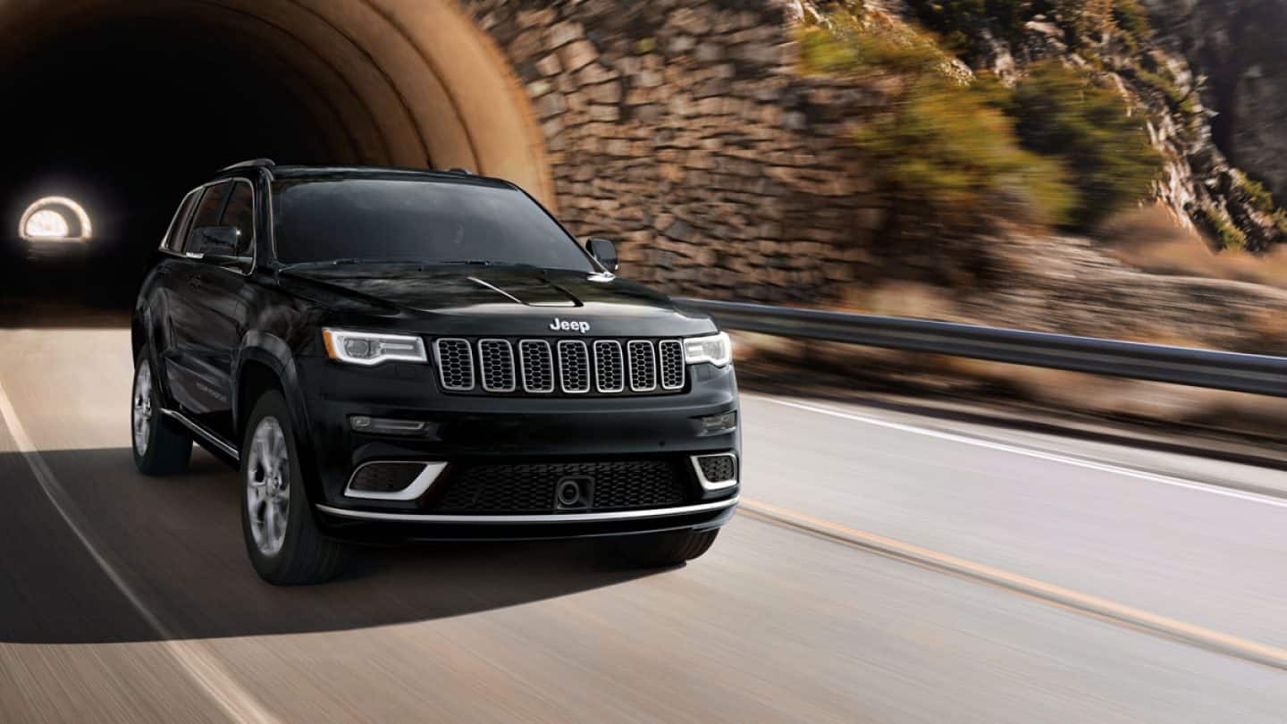 Jeep Grand Cherokee emerging from a tunnel.