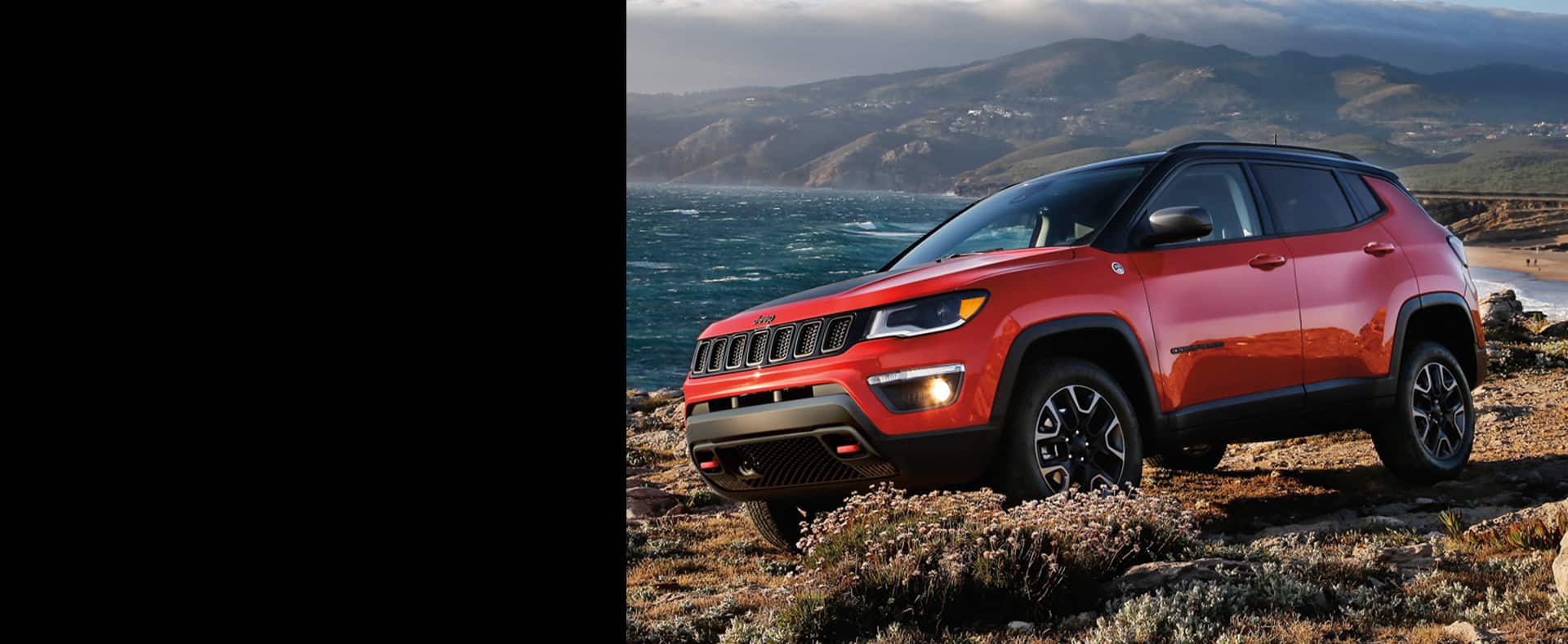 2021 Jeep Compass on a lakeside trail.