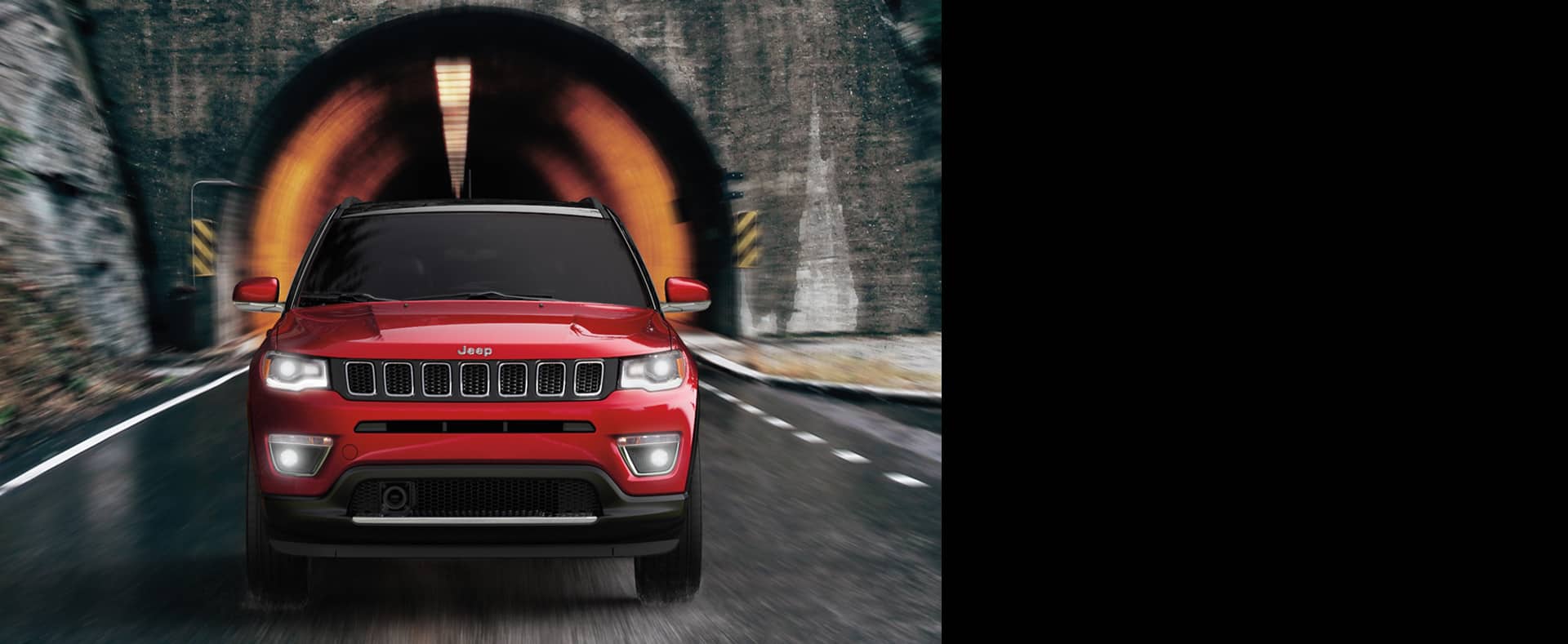 2021 Jeep Compass emerging from a tunnel.
