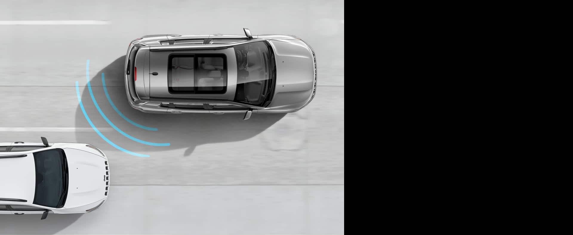 Illustration of sensors emanating from the rear of 2021 Jeep Compass as another vehicle approaches it from behind.