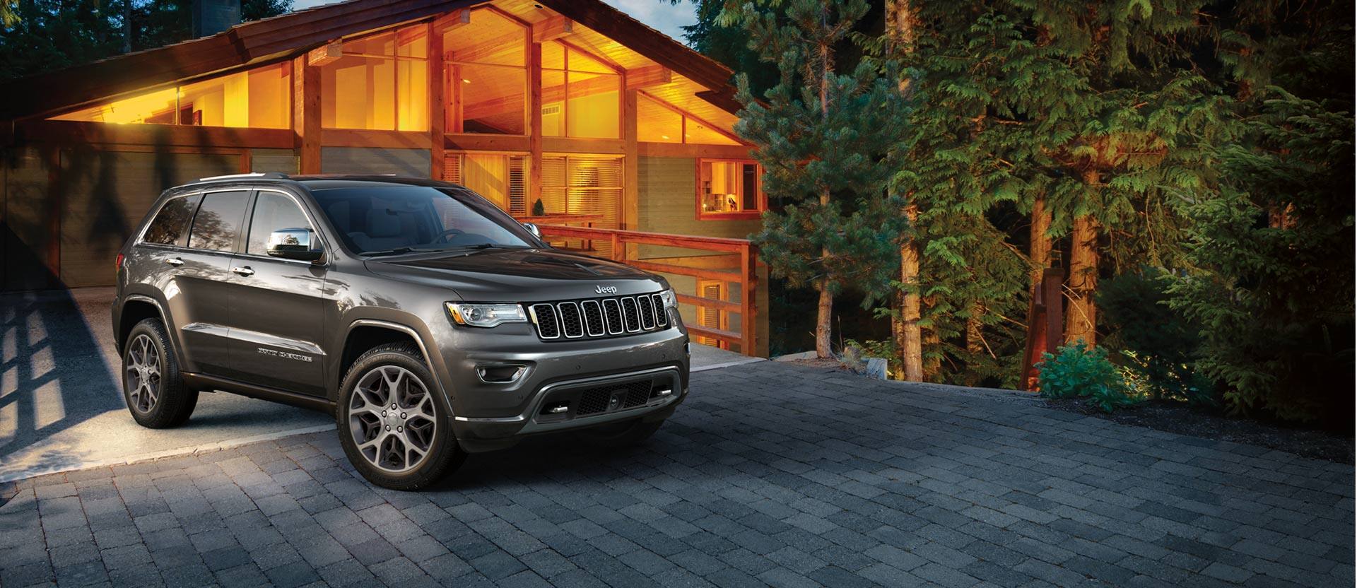 Jeep Grand Cherokee parked in a driveway.