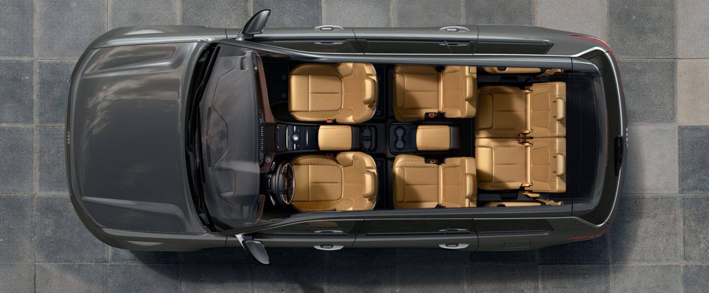 A bird's eye view of a 2021 Jeep Grand Cherokee L with the roof removed, displaying the six-passenger seating and second-row console in tan.