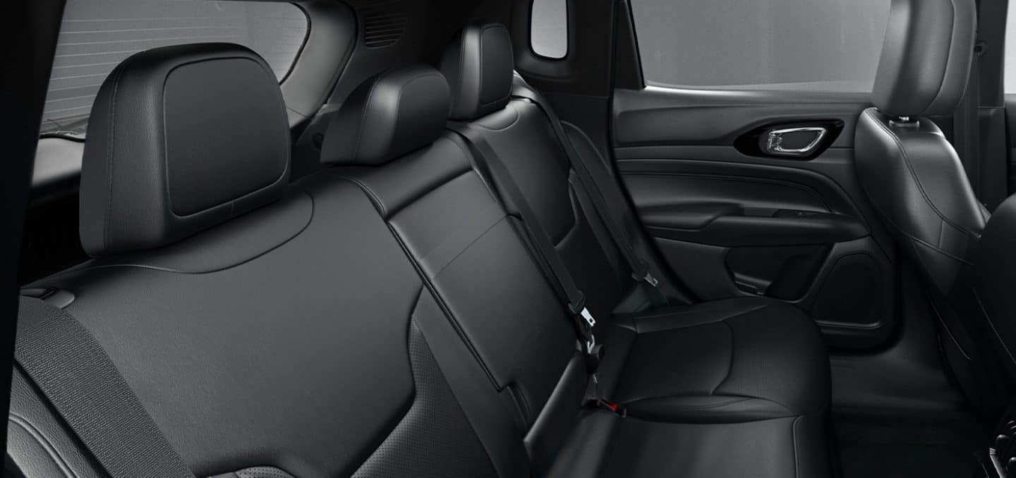 Display The rear seats in the 2022 Jeep Compass in black.