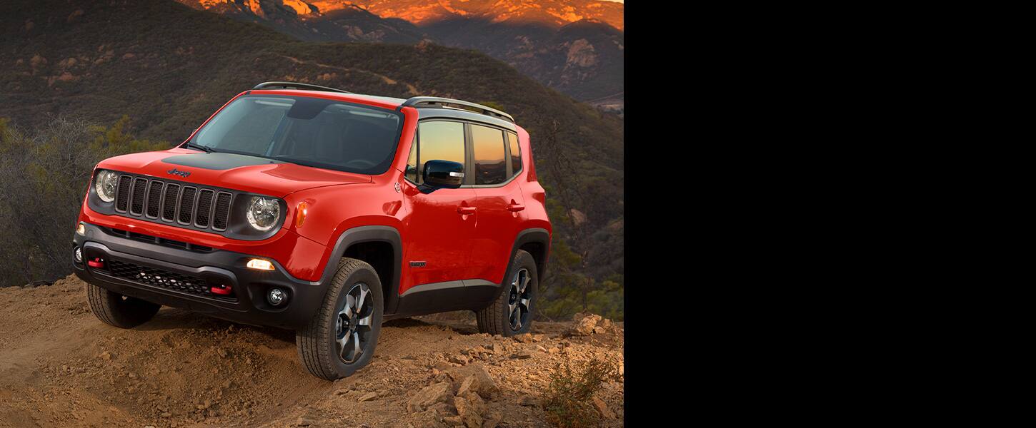The 2022 Jeep Renegade Trailhawk being driven off-road on soft, muddy terrain.