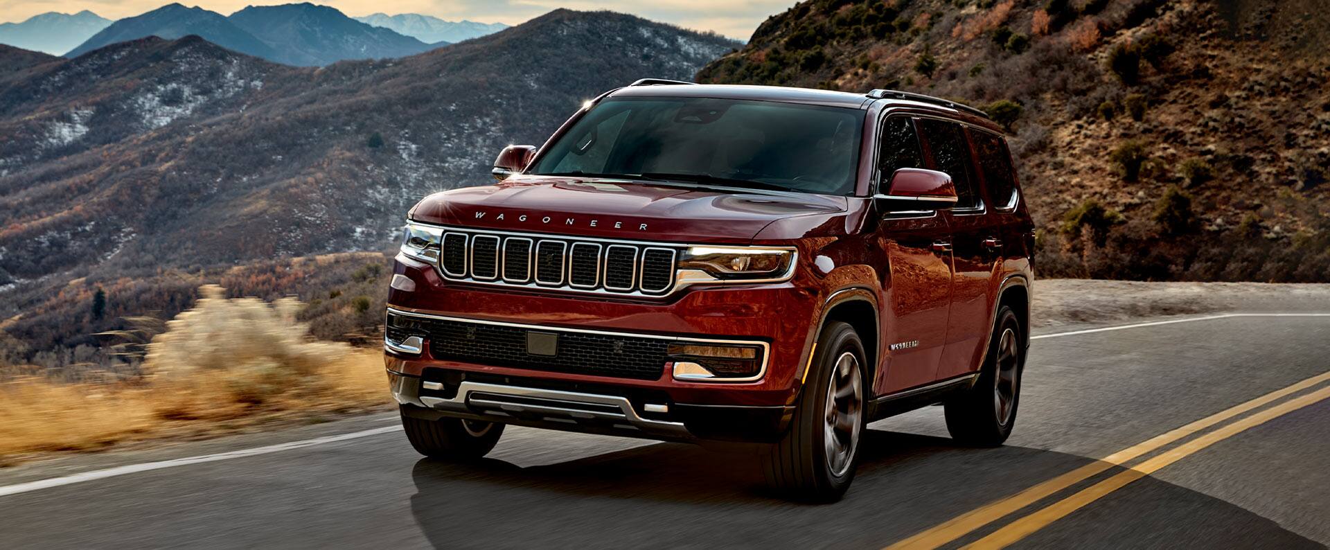 The 2022 Wagoneer Series III being driven on a two-lane mountain road.