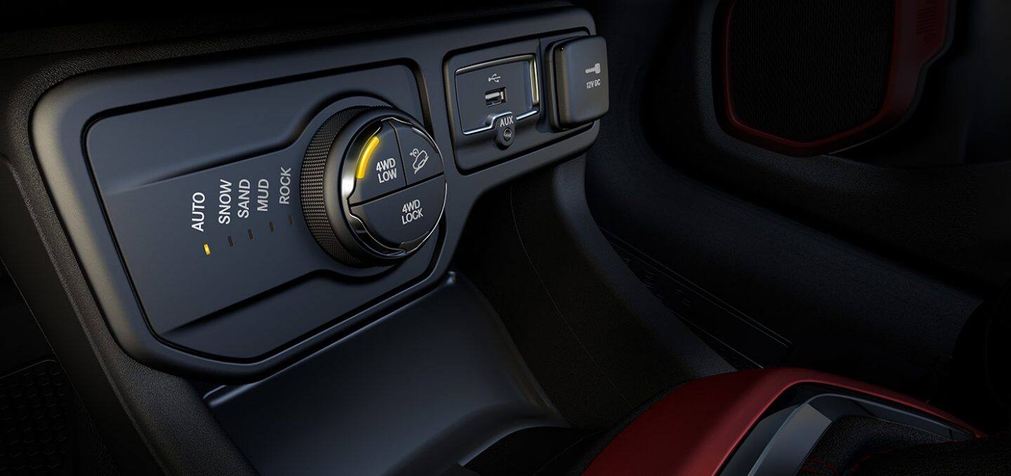 Display A close-up of the off-roading controls in the 2022 Jeep Renegade, with Selec-Terrain set to Auto and 4WD Low selected.