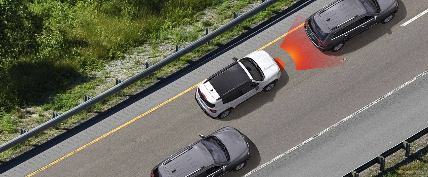 A bird's eye view of the 2022 Jeep Renegade with illustrated sensor bars coming from its front, detecting the vehicle ahead.