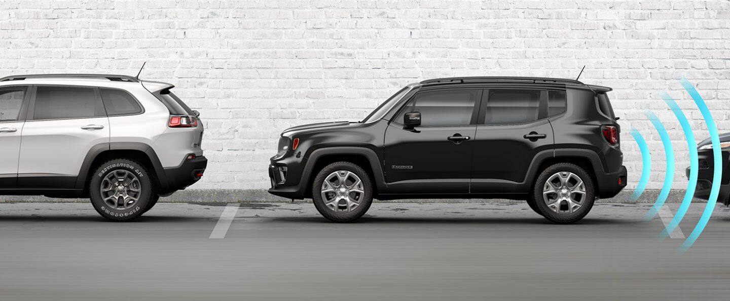The 2022 Jeep Renegade parked at a curb between two vehicles, with illustrated sensor bars coming from its rear to detect the vehicle behind it.