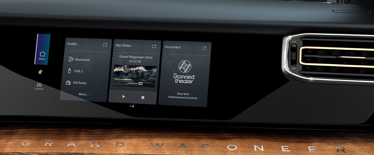 The passenger interactive display in the 2022 Grand Wagoneer with three windows displayed showing audio options, video options and Uconnect theater options.