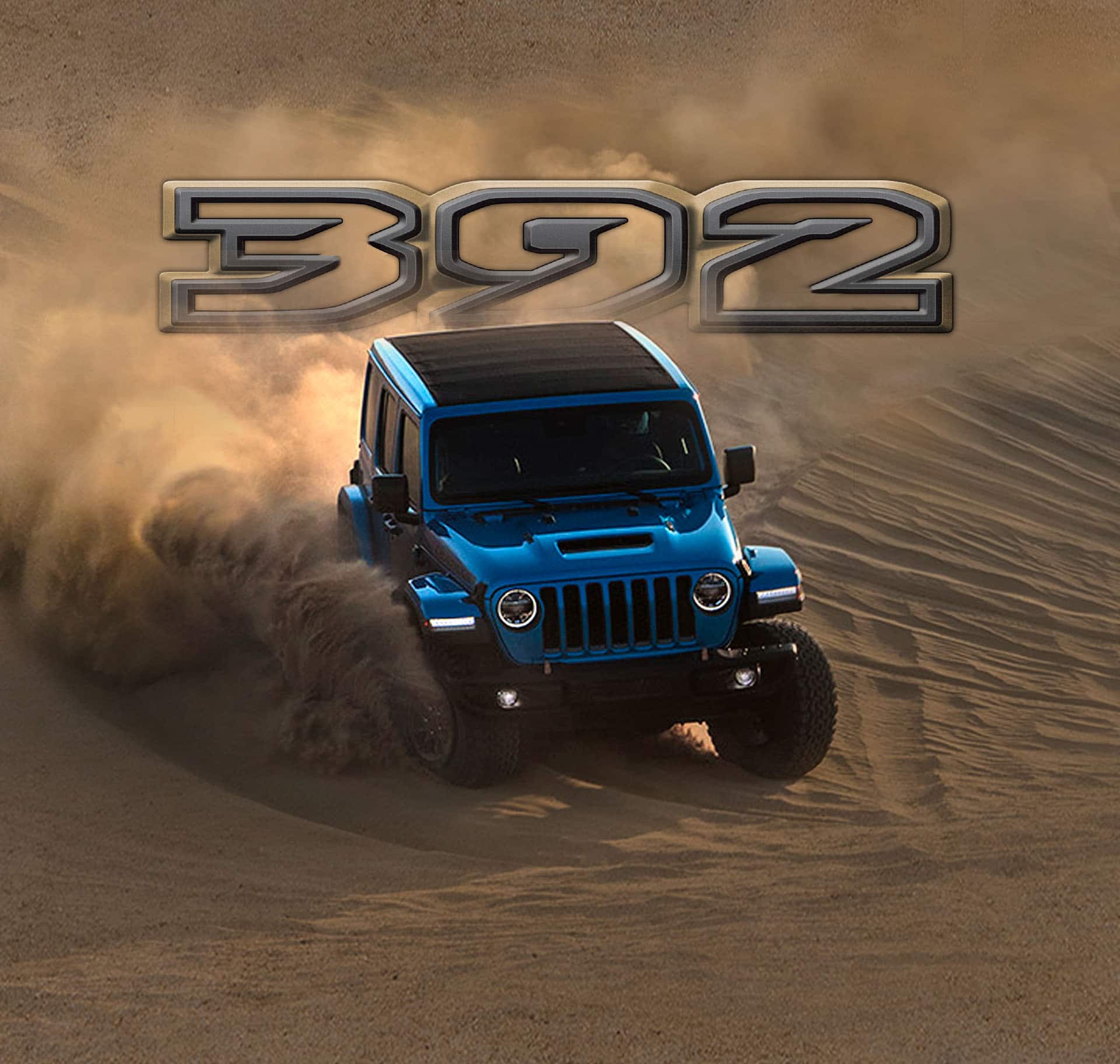 El logo 392 posicionado arriba de un Jeep Wrangler 392 2022 bajando una cuesta de arena, levantando polvo en su recorrido.