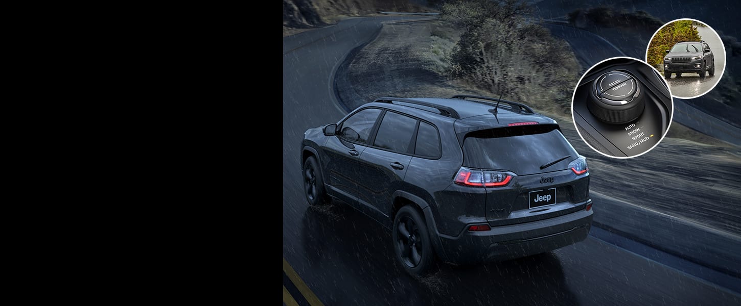 A rear angle of a 2023 Jeep Cherokee Altitude Lux being driven on a curved road in a rainstorm at twilight, with two inset images: a close-up of the Selec-Terrain mode selector and a 2023 Jeep Cherokee Altitude Lux being driven in the rain.