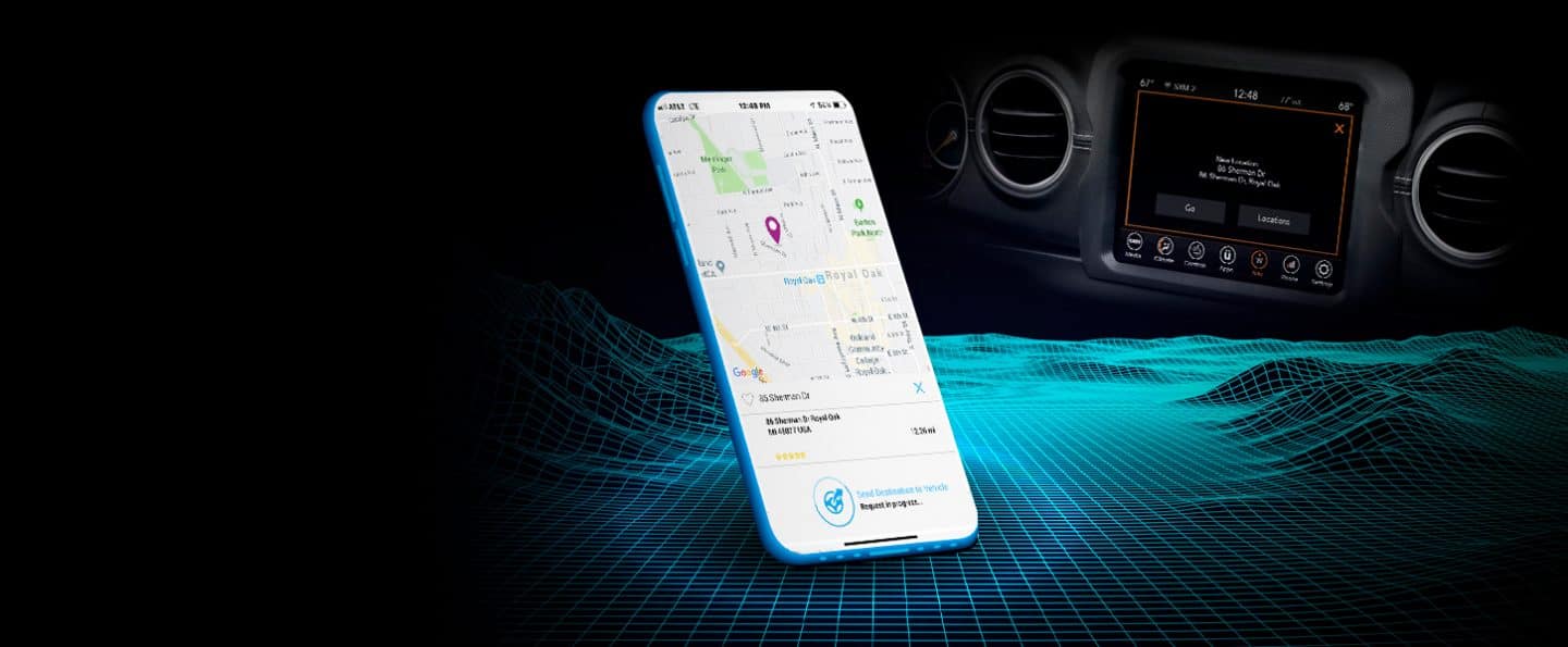 The Jeep Gladiator app on a smartphone displaying the percentage of remaining fuel, the current mileage and the tire pressure in all four tires. The Uconnect touchscreen is displayed in the background.