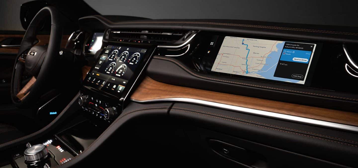 Display A close-up of the touchscreen in the 2023 Jeep Grand Cherokee Summit Reserve with route guidance on-screen.