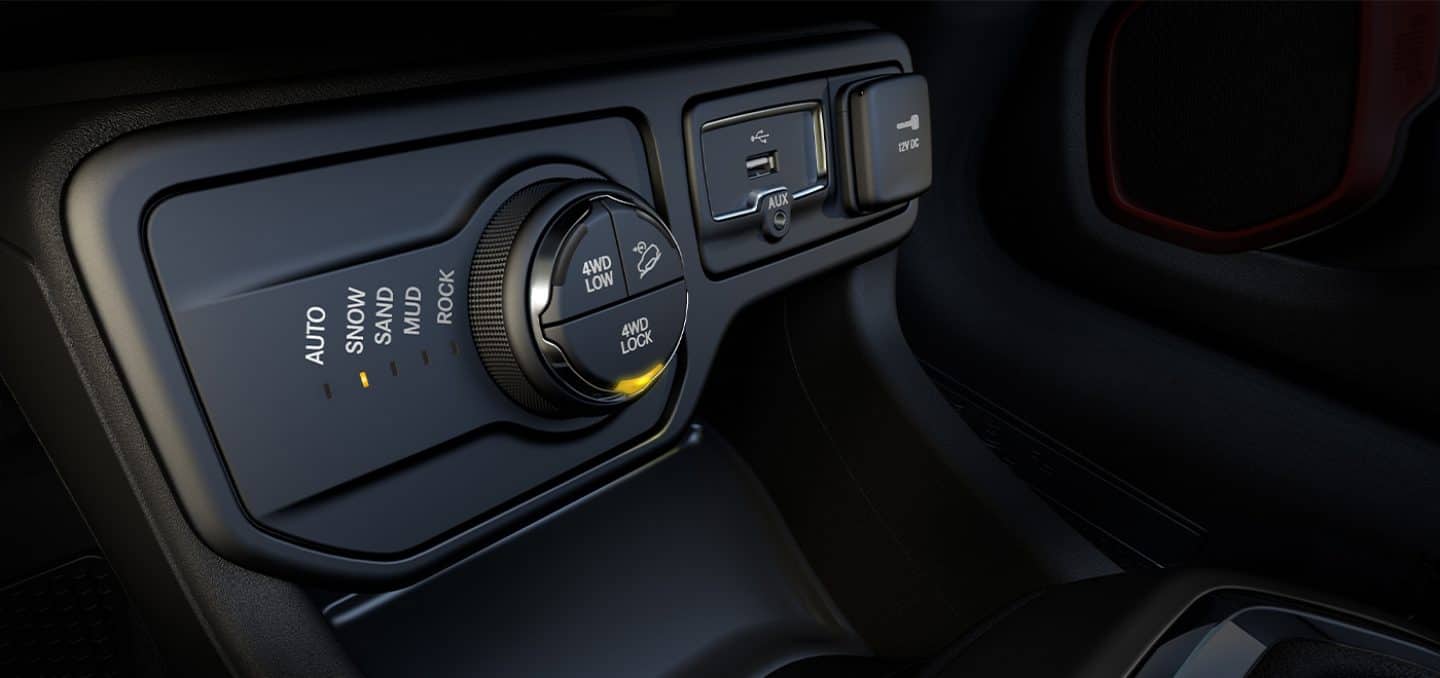 Display A close-up of the five Selec-Terrain settings with "Snow" lit and the 4WD dial with "4WD Lock" lit, in the 2023 Jeep Renegade.