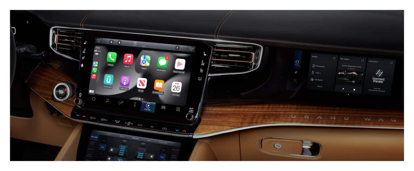 The Uconnect touchscreen in the 2023 Grand Wagoneer Series III displaying a variety of Apple CarPlay selections.