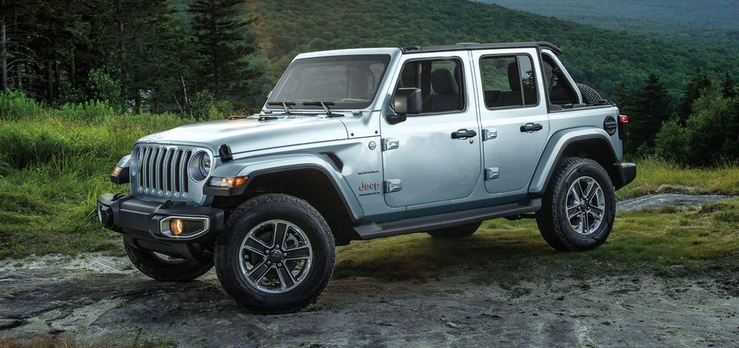 Display A three-quarter profile of the 2023 Jeep Wrangler Overland on a dirt trail.