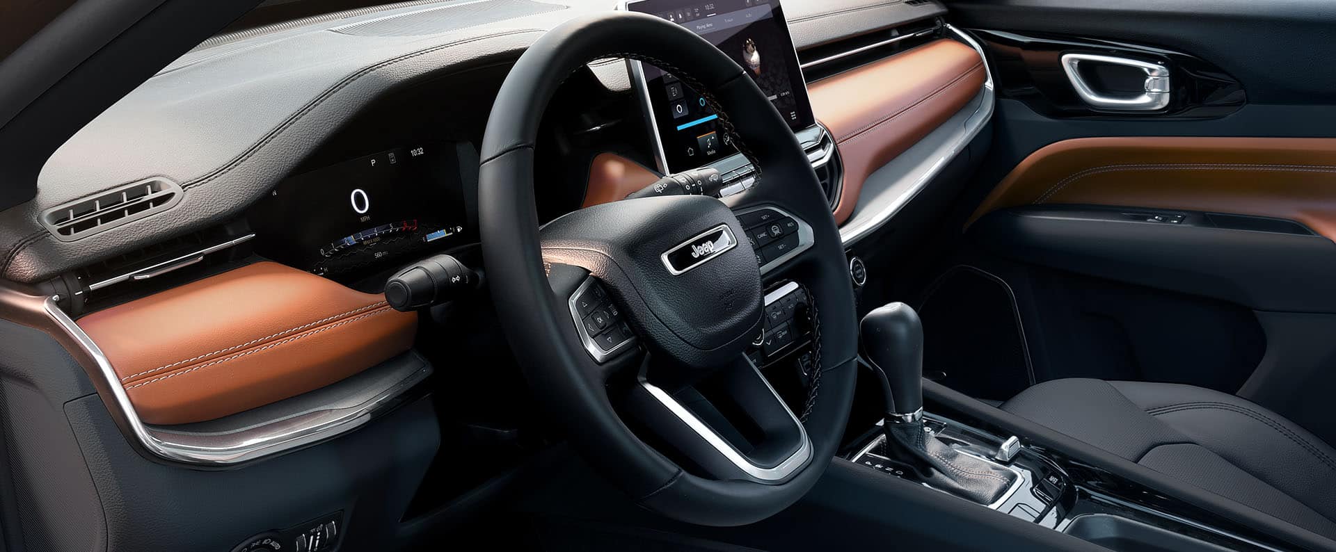 The steering wheel and Driver Information Digital Cluster Display in the 2024 Jeep Compass Limited.