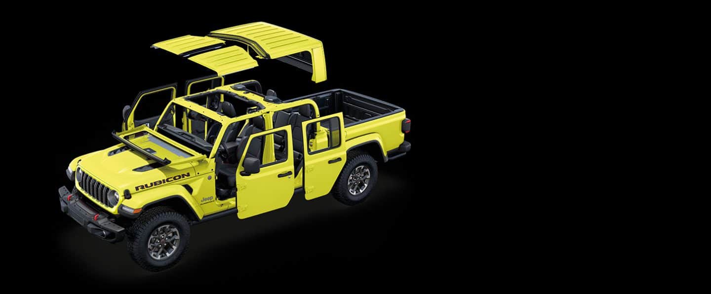 A yellow 2024 Jeep Gladiator Rubicon with the roof and doors detached and the windshield folded.