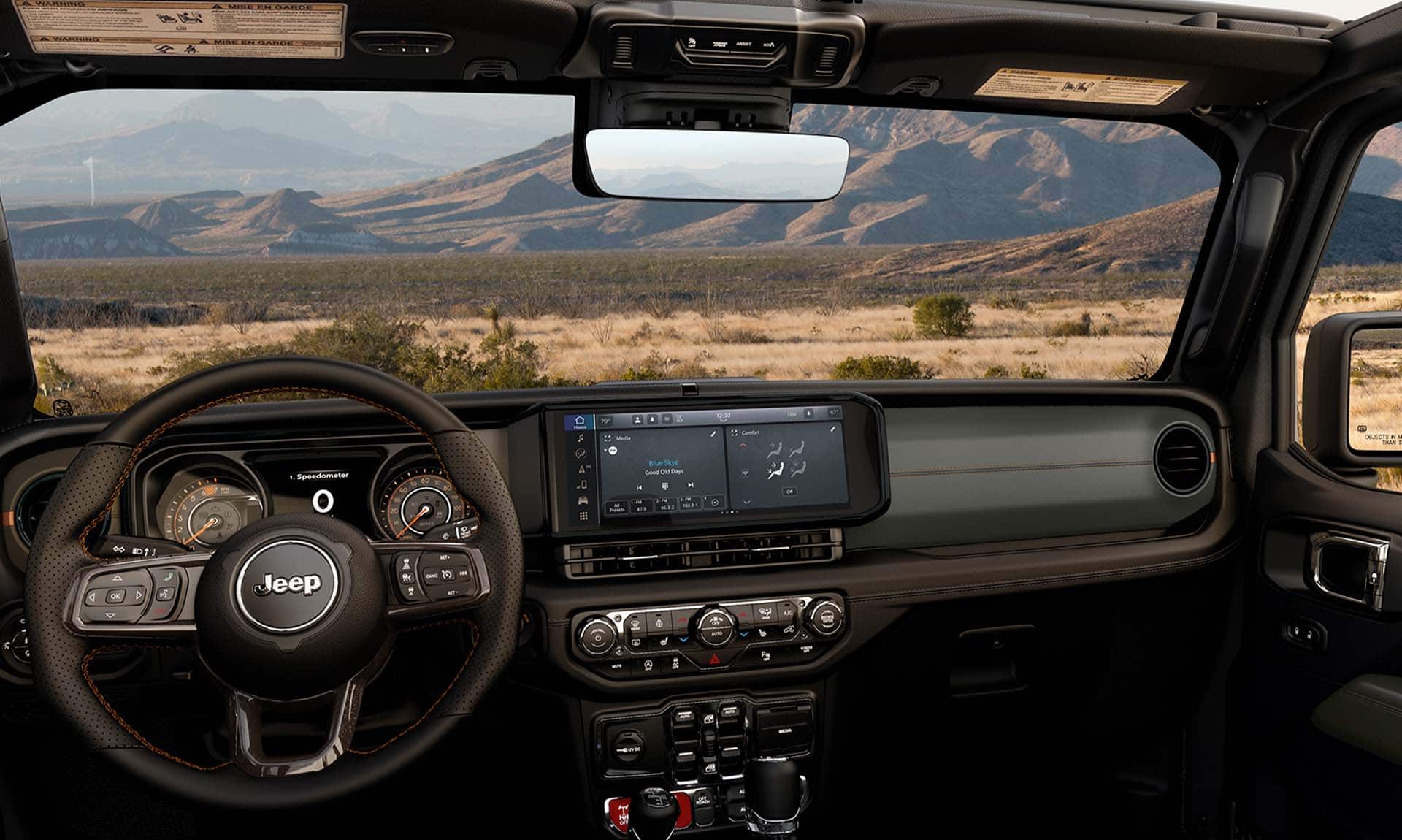 The windshield, steering wheel, Driver Information Digital Cluster and Uconnect touchscreen in the 2024 Jeep Gladiator.