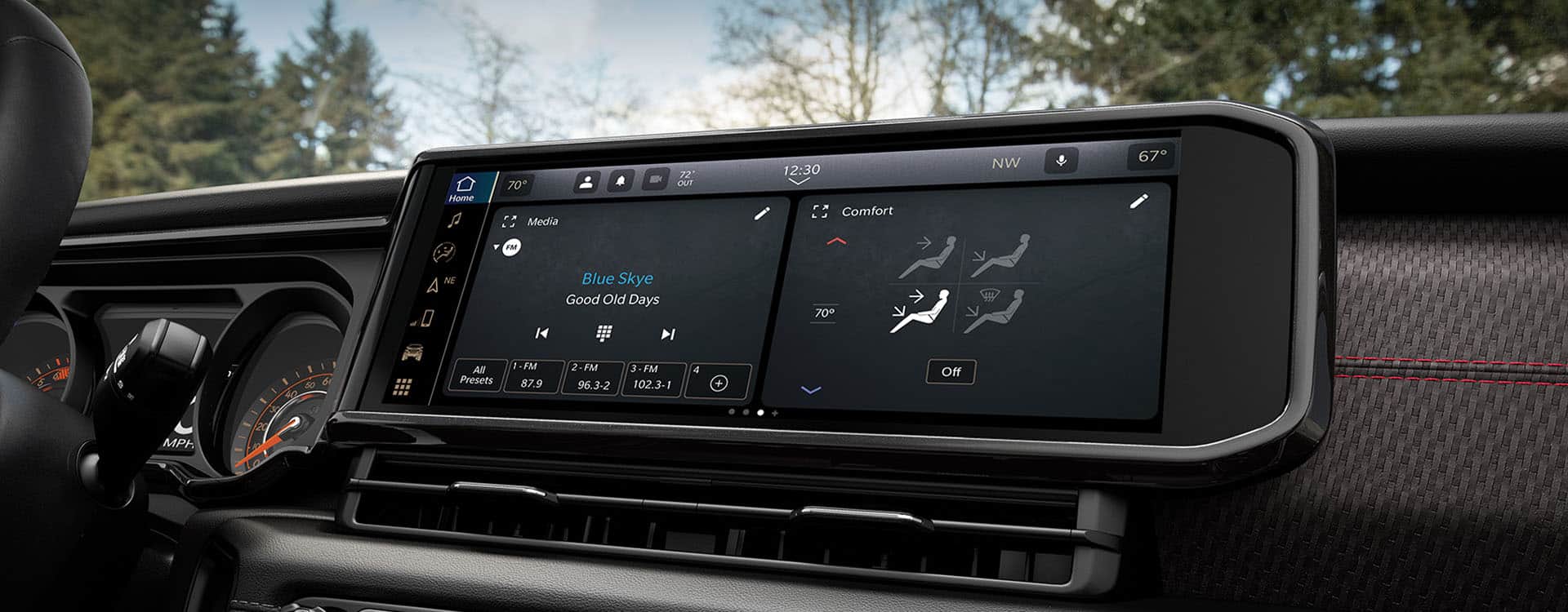 The Uconnect touchscreen in the 2024 Jeep Gladiator with a split screen displaying an audio selection on the left, and the climate controls on the right.