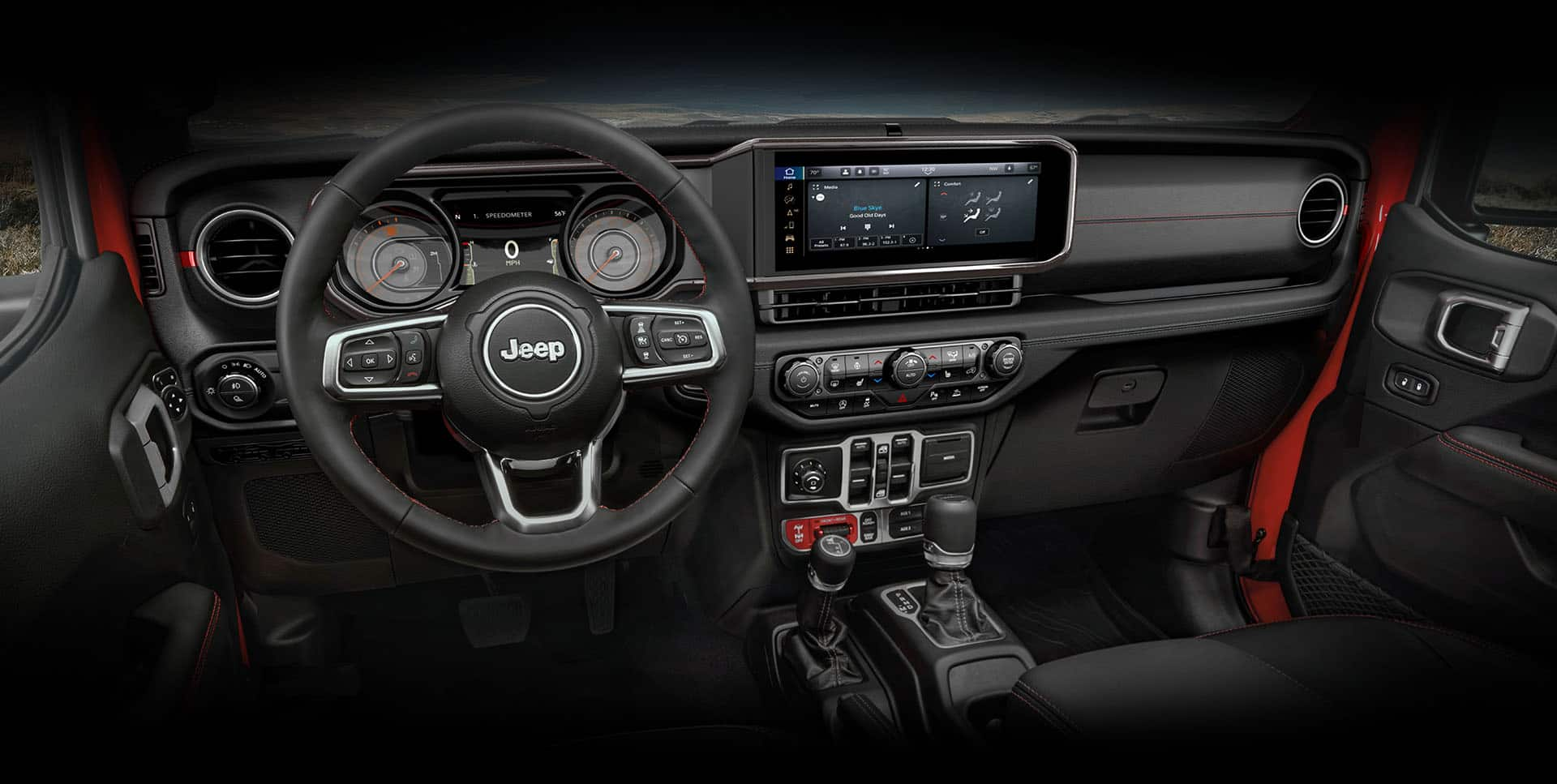 El volante, la pantalla digital de información para el conductor en el panel de instrumentos, la pantalla táctil de Uconnect, los controles de la consola central y el tablero en la Jeep Gladiator Rubicon 2024.