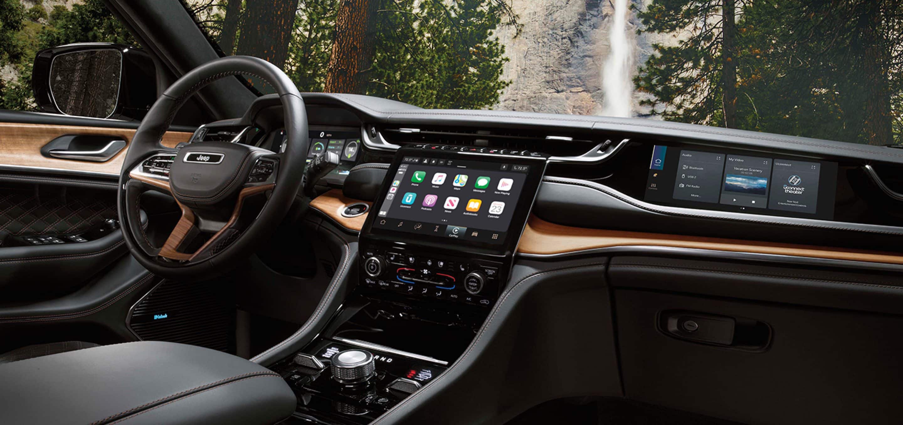 Cockpit view of the 2024 Grand Cherokee 4XE plug in hybrid 10.1 inch touch screen and co-pilot navigation screen