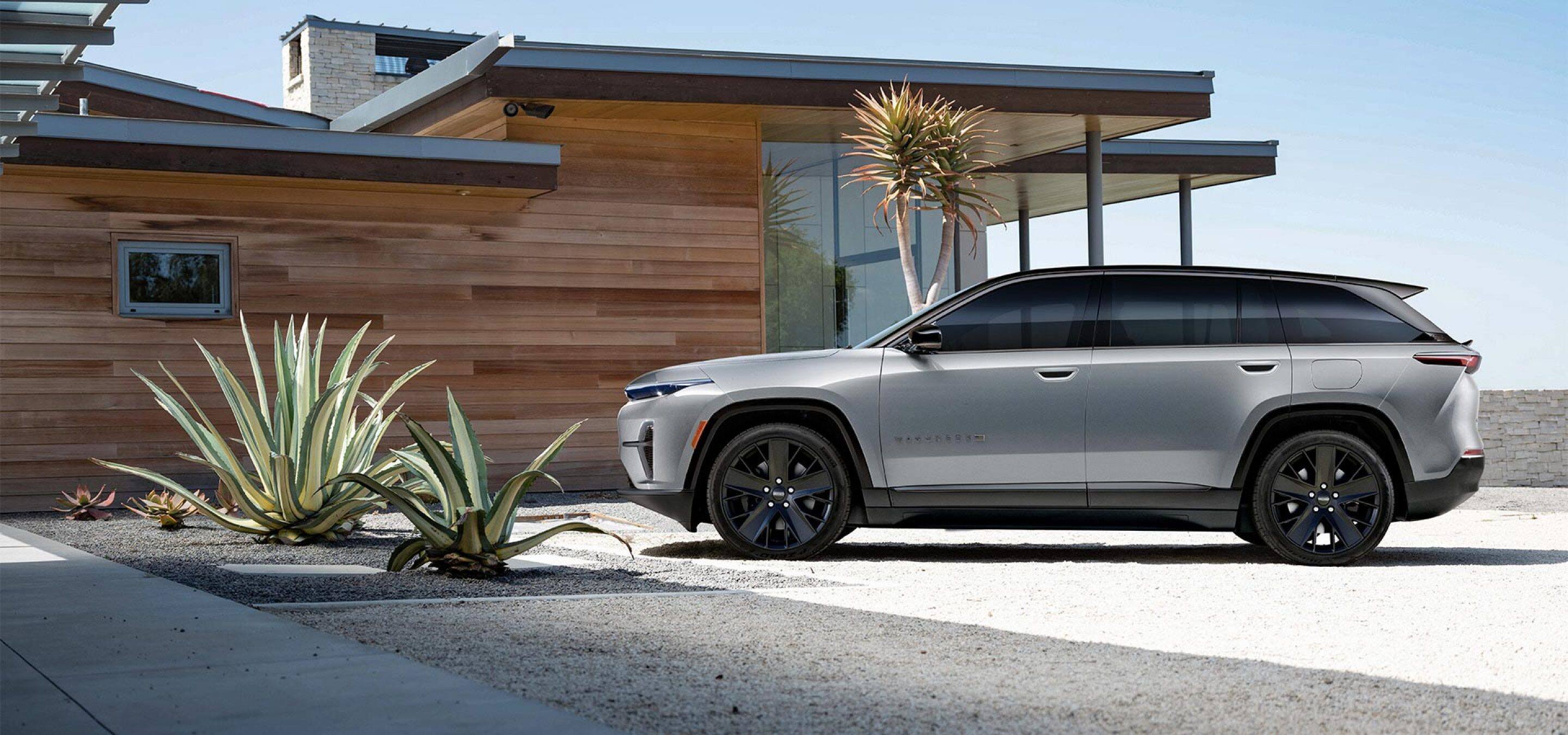 2024 Jeep Wagoneer S in Silver Zynith parked in front of modern desert home.