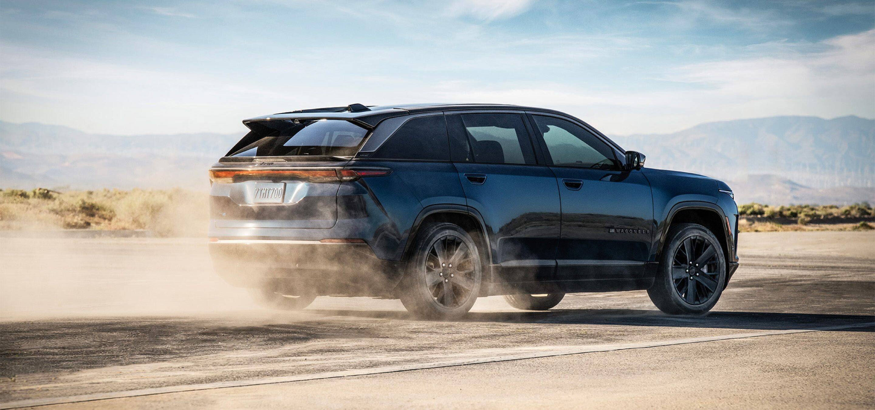 2024 Jeep Wagoneer S in Black drifting in desert.