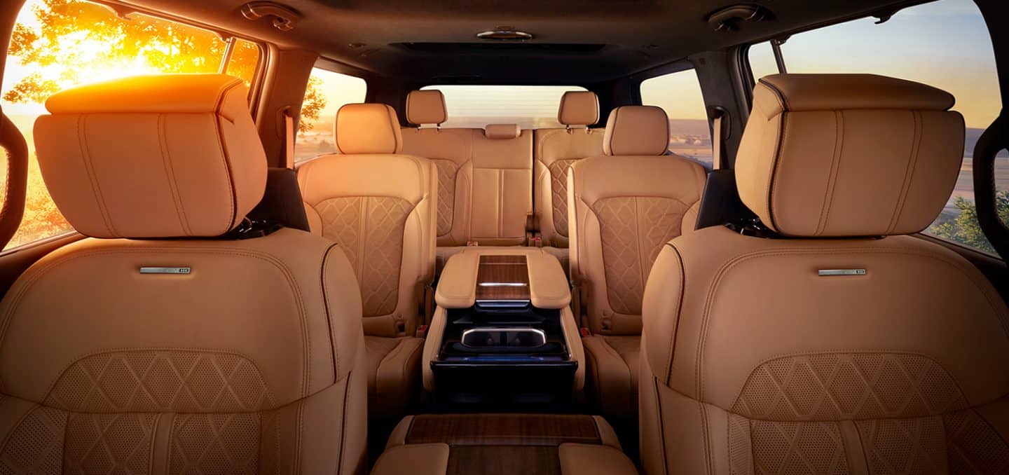 Display The interior of the 2024 Grand Wagoneer Series III displaying the three rows of seats, from front to back.