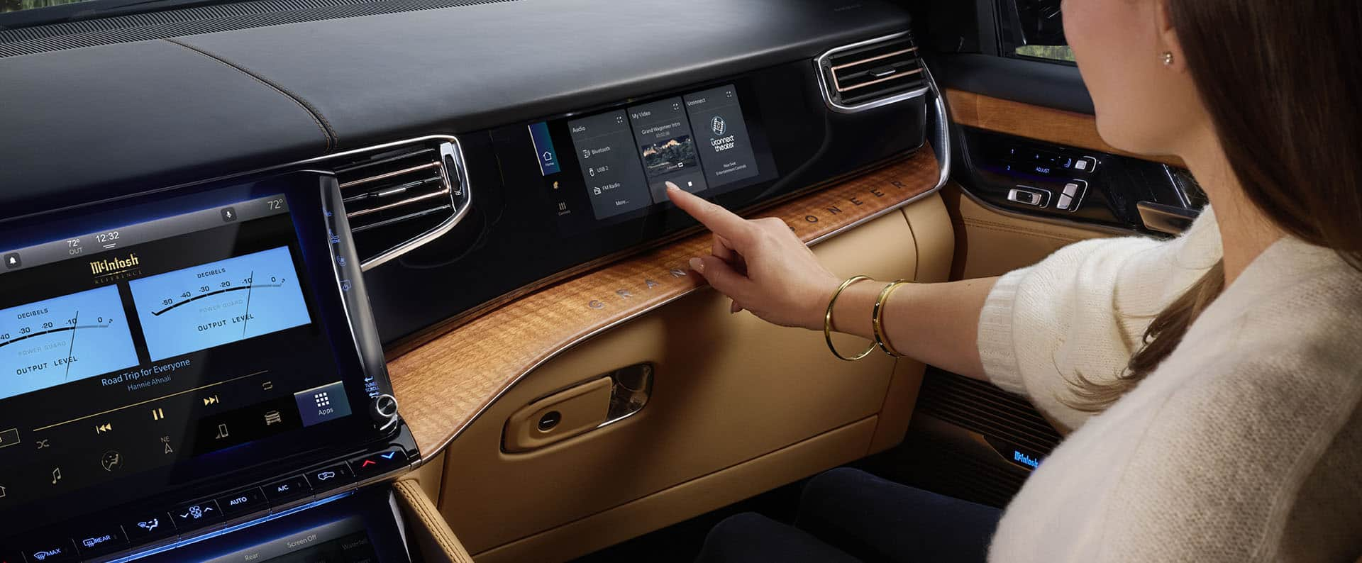 The passenger-side of the dash in the 2024 Grand Wagoneer, displaying both the Uconnect touchscreen and the Passenger Interactive Display.