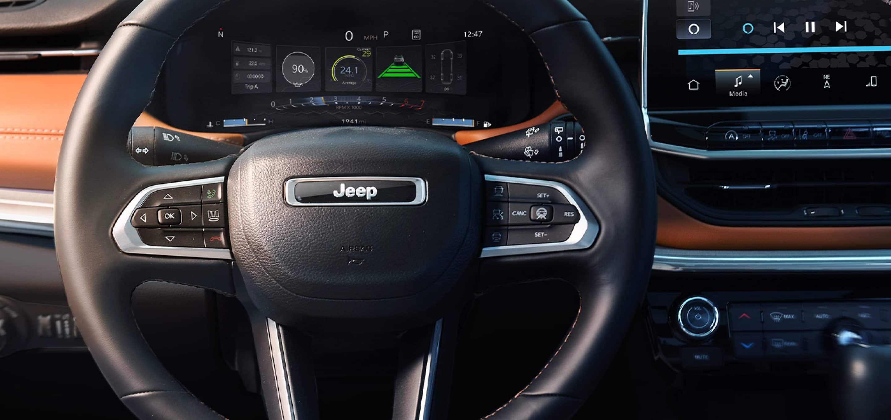 2025 Jeep Compass Sport black leather steering wheel with brown accented leather trim
