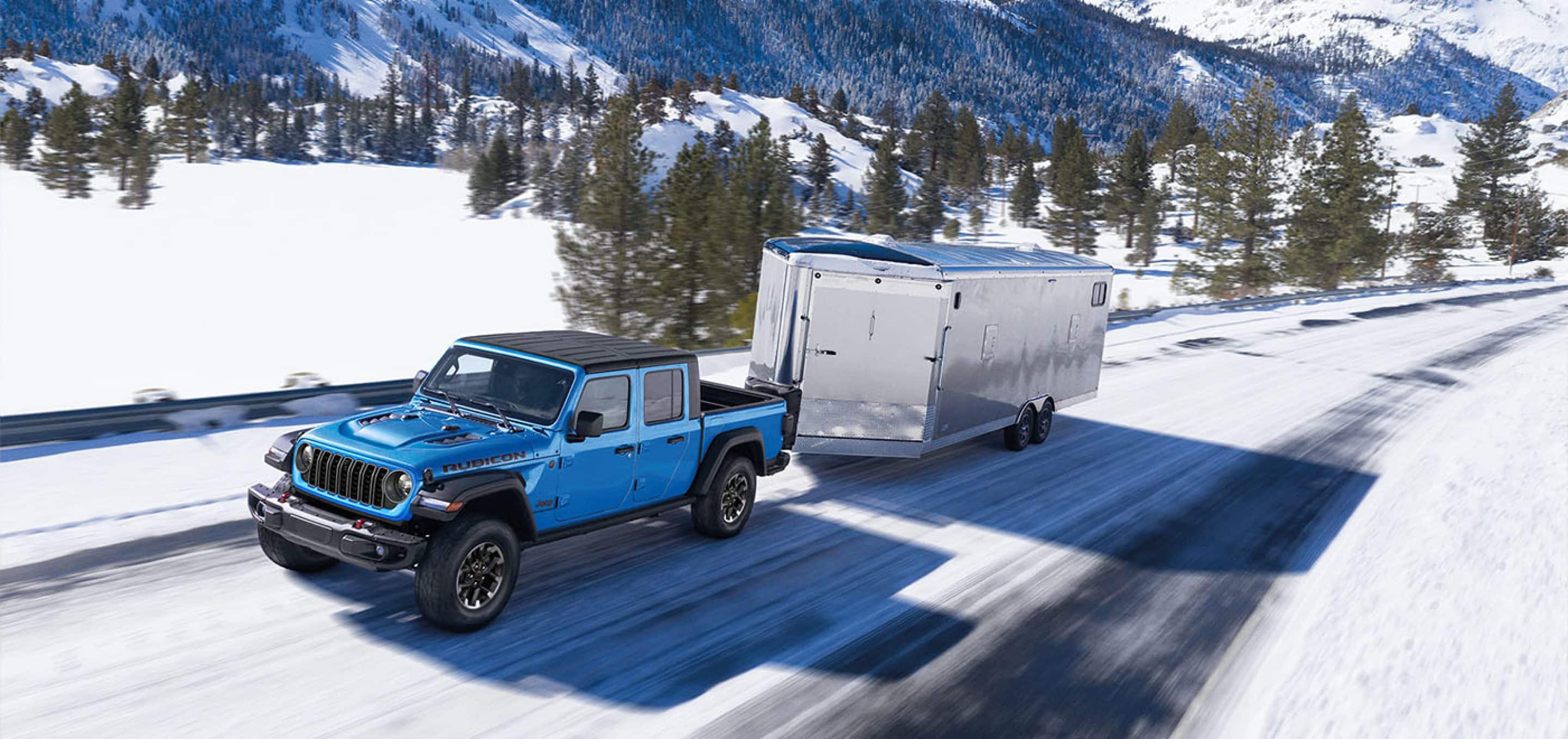 2025 jeep gladiator rubicon towing trailer on icy road
